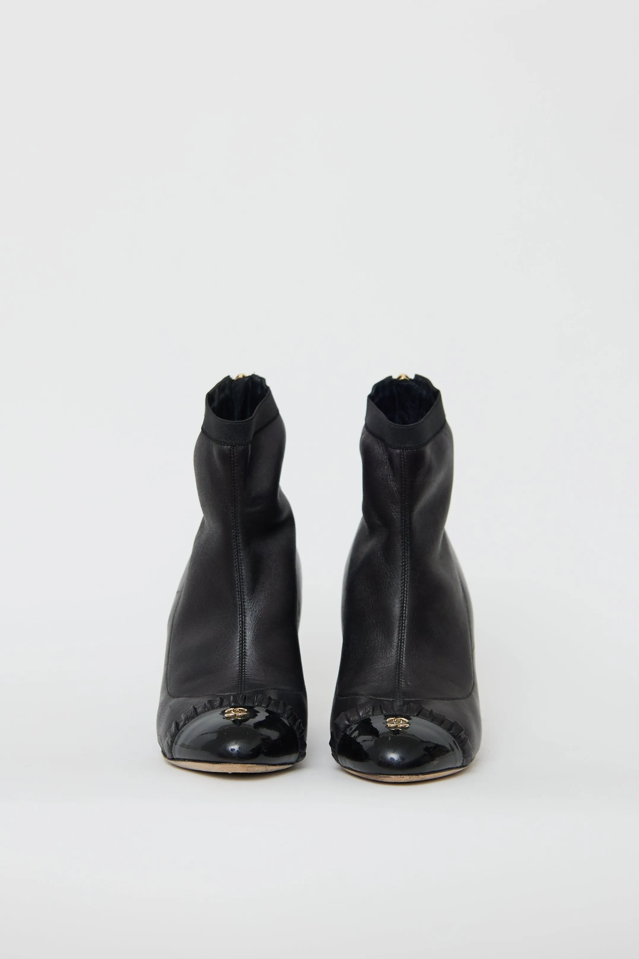 Black Leather Ruffled Ankle Boot