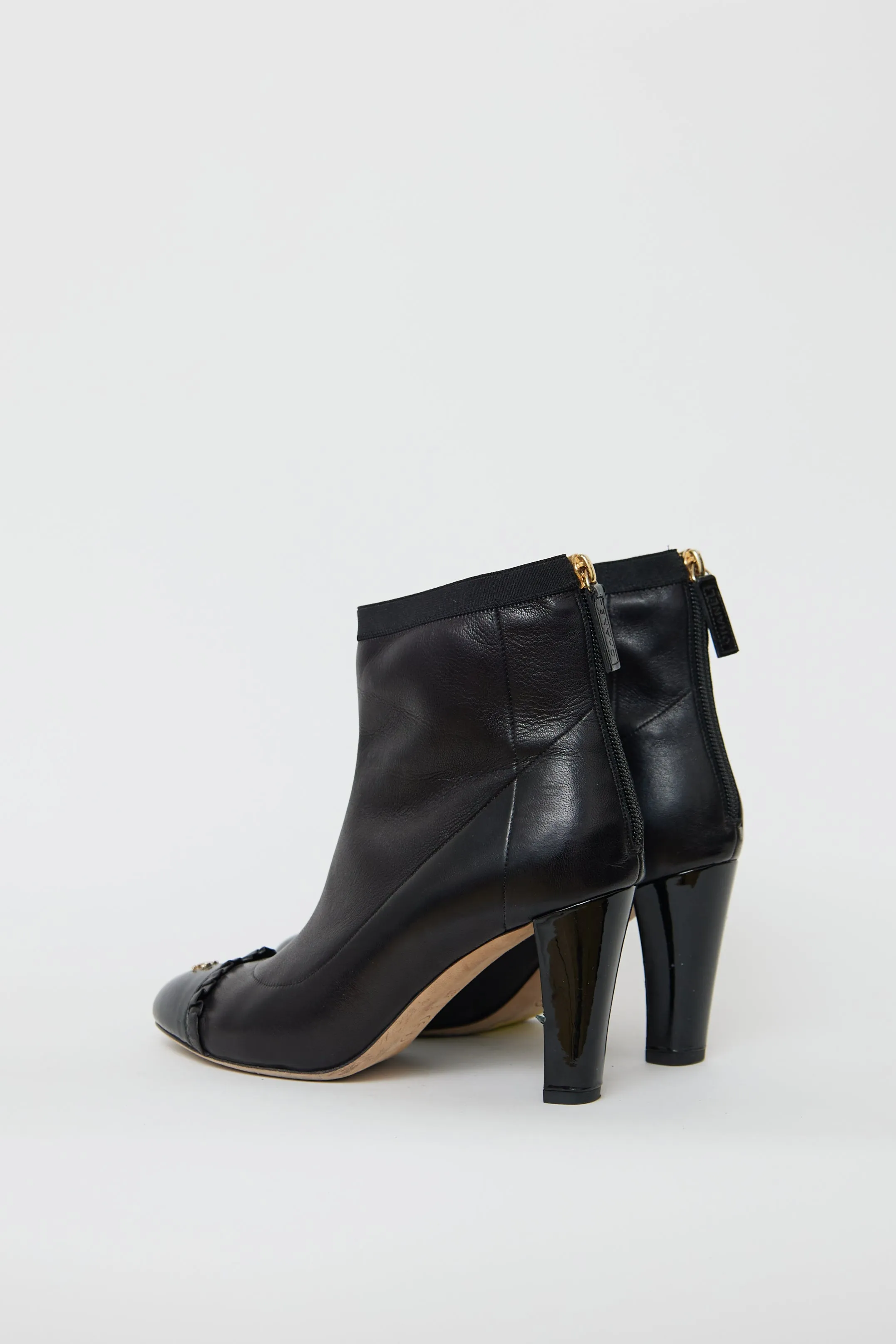 Black Leather Ruffled Ankle Boot